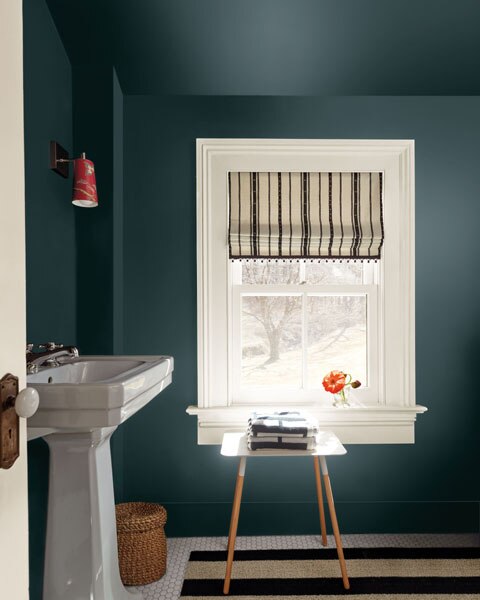 A colour drenched cloakroom painted in Narragansett Green HC-157 with door and woodwork painted in Swiss Coffee OC-45.