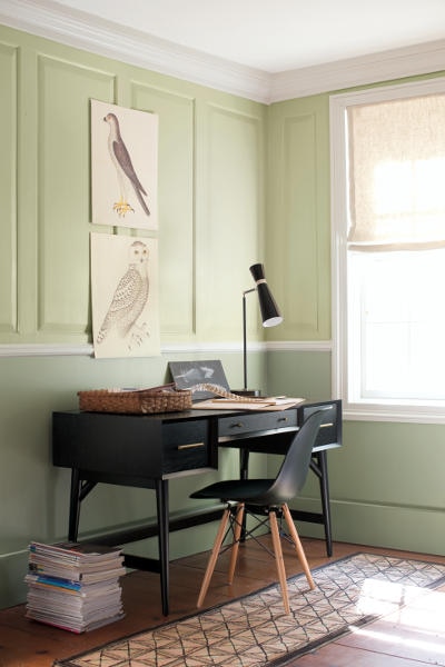 A study featuring a contemporary Twilight Zone 2127-10 desk and chair. The upper panelled walls are painted with Fernwood Green 2145-50 and the lower walls showcase Urban Nature AF-440